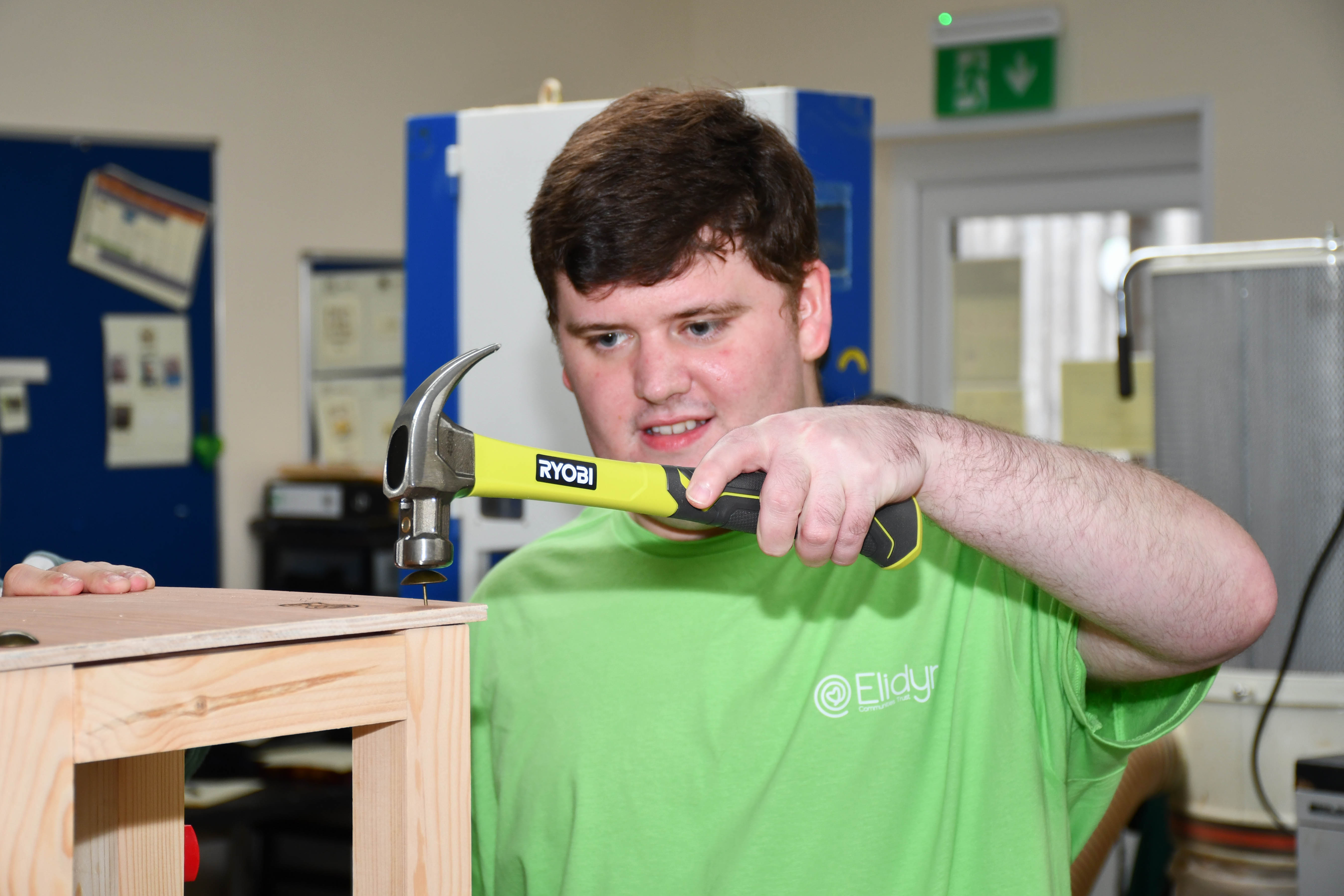 Learner using a hammer