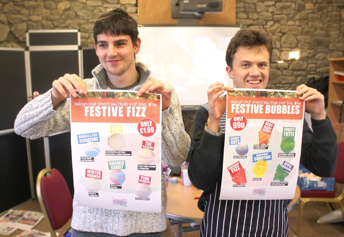 Boys holding Bubble & Fizz posters