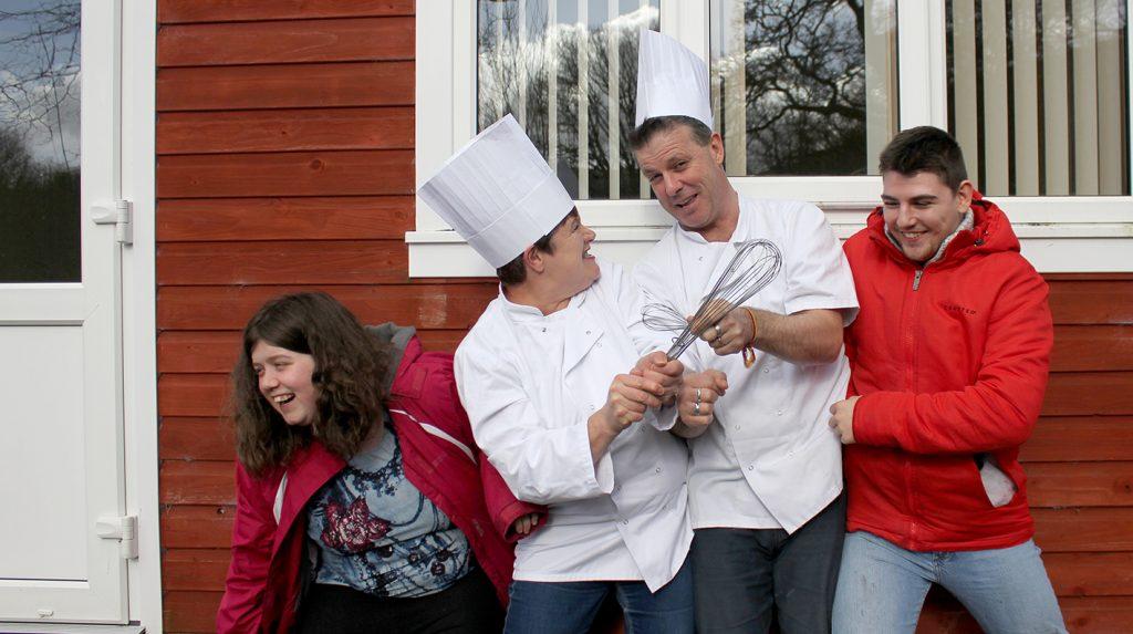 Young people dressed in chef whites