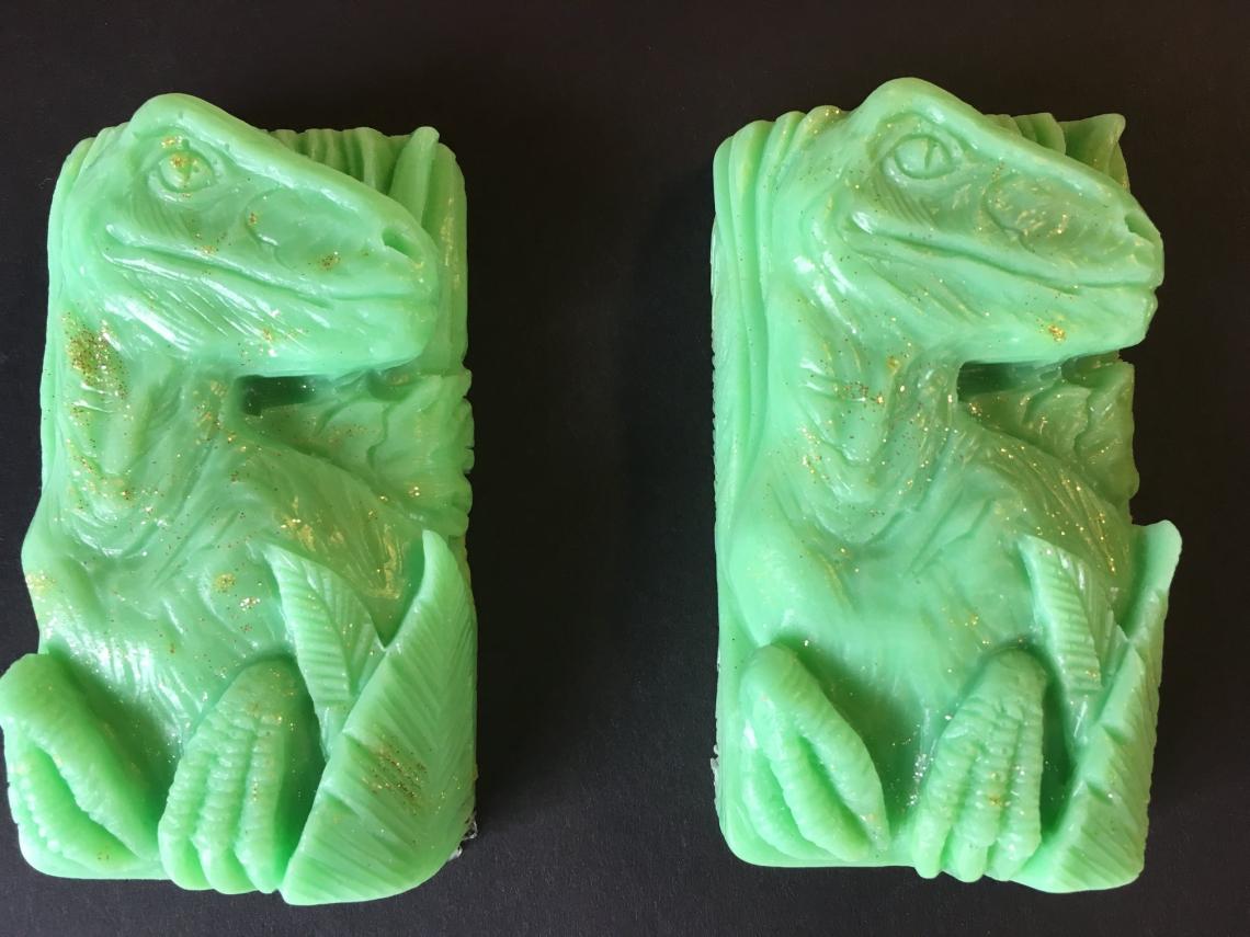 2 green dinosaur soaps.