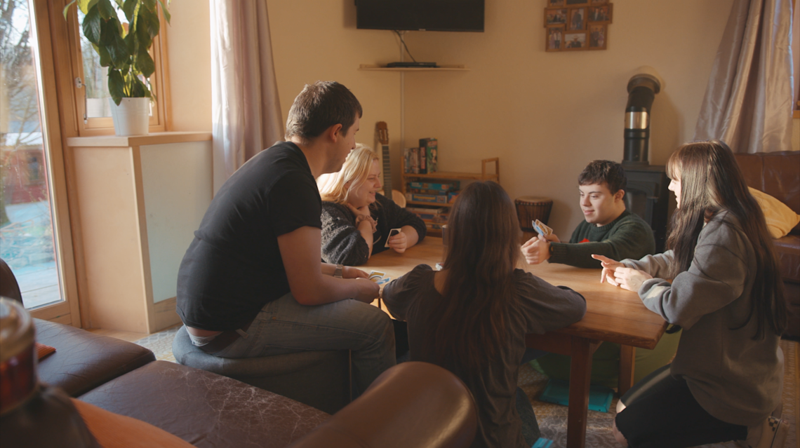 People playing cards around a table.