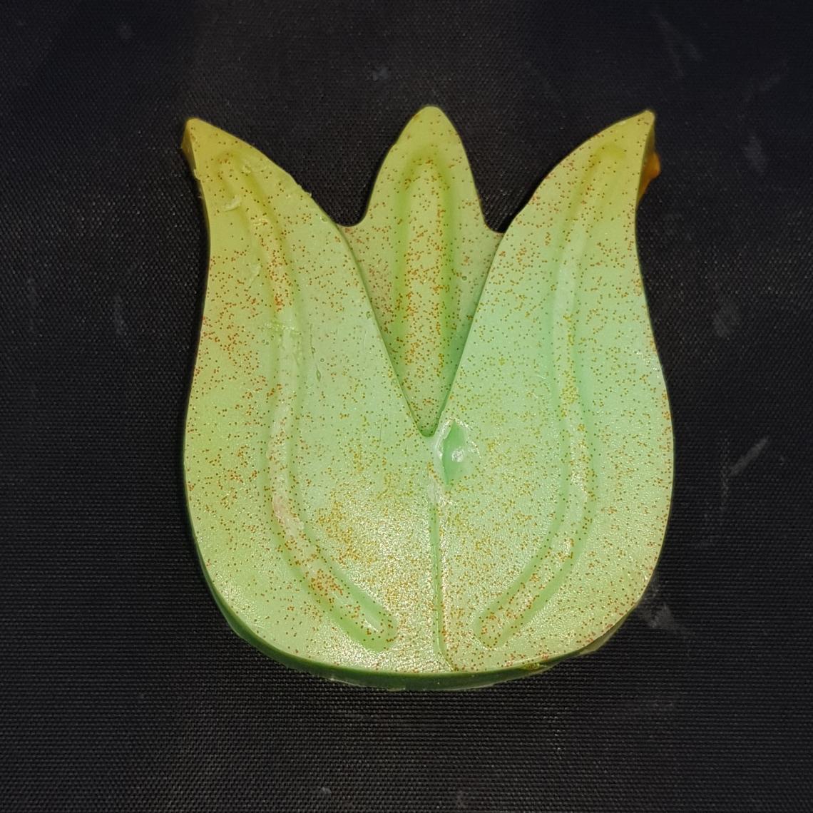 Green soap shaped like a tulip.