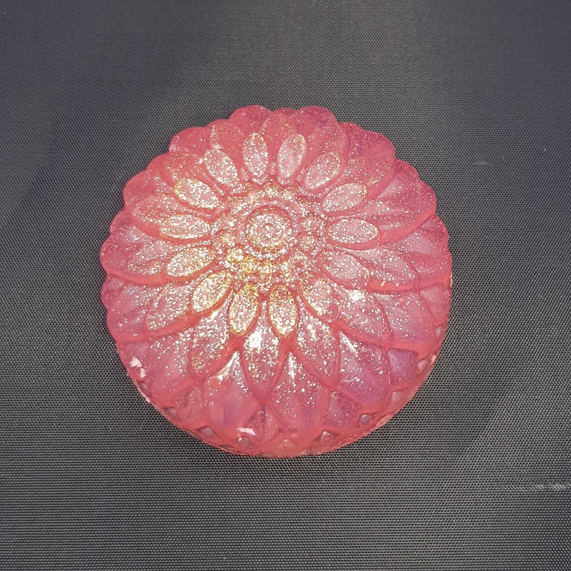 Pink flower soap with glitter.