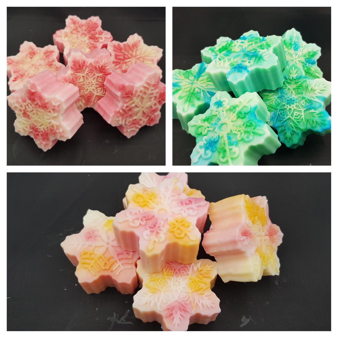A close up of snowflake soaps.