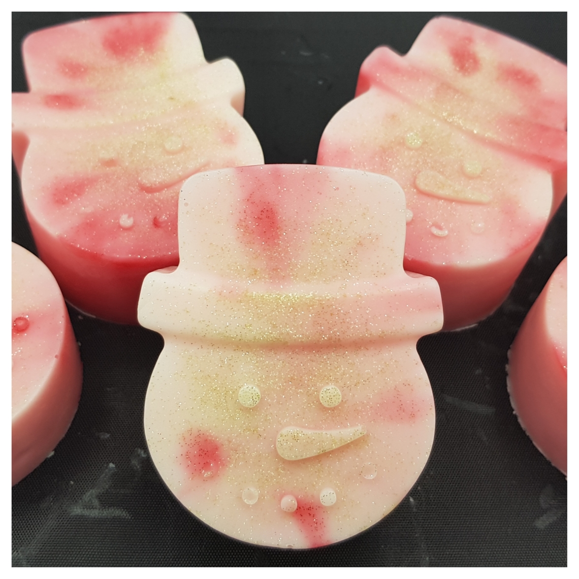 A close up of a snowman soap.