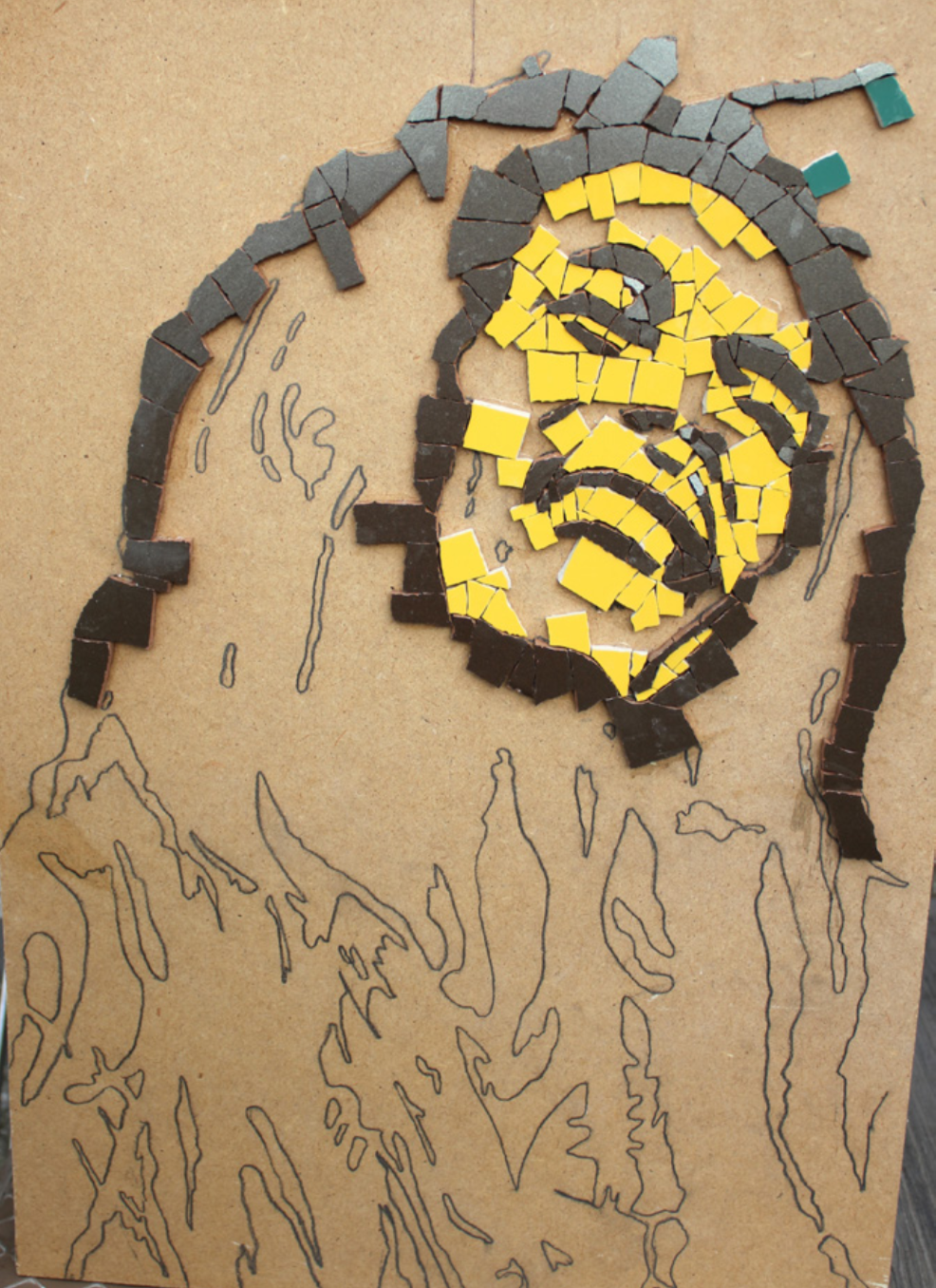 A mosaic of Bob Marley in process of being made.