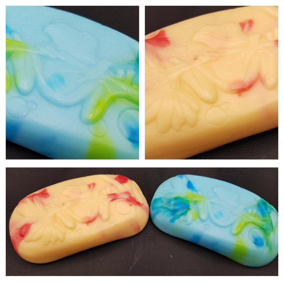 Two frog soaps in blues and oranges.