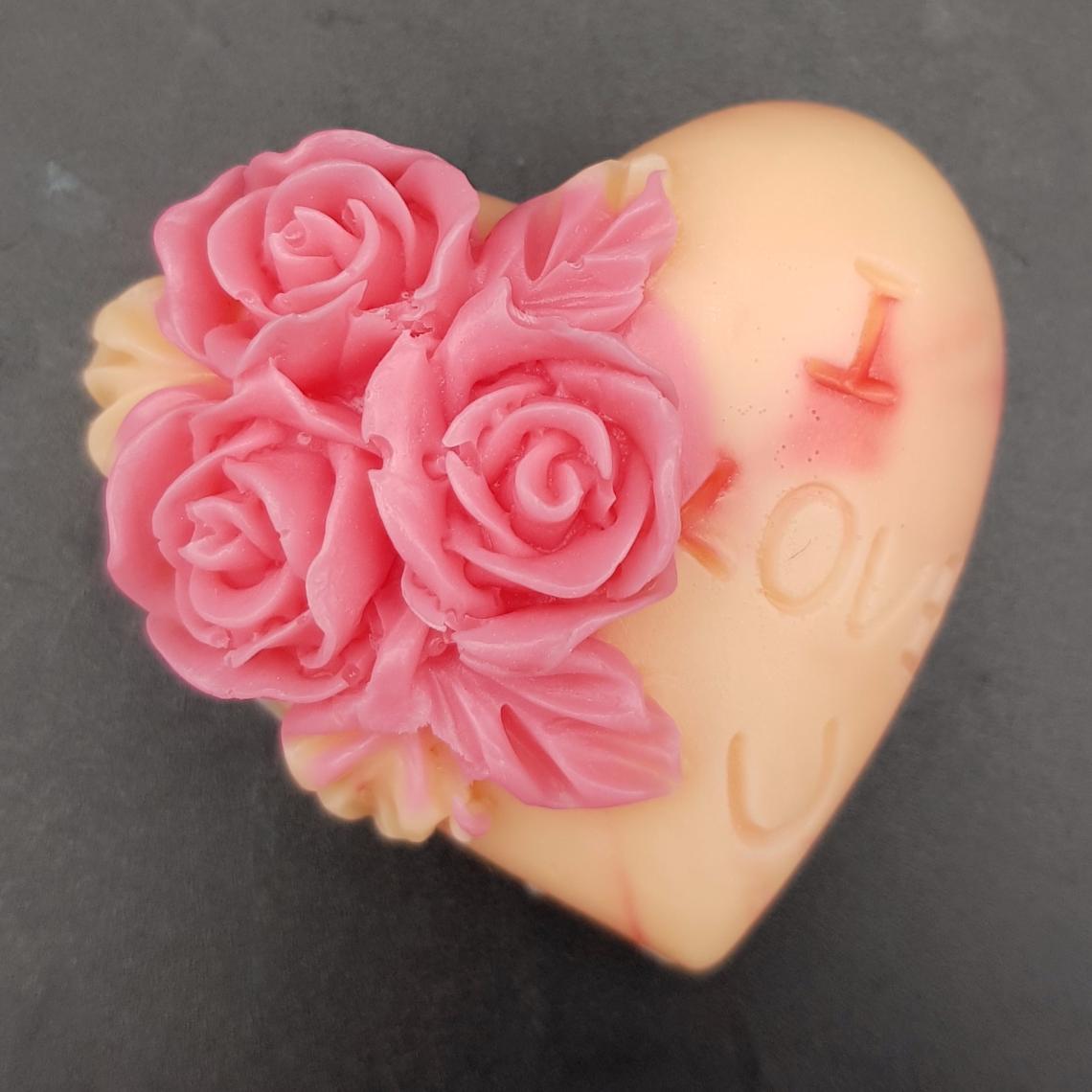 A pale pink soap with dark pink flowers on.
