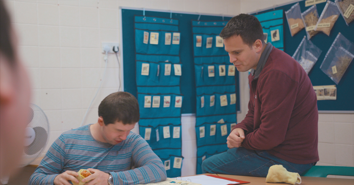 Support worker in classroom at Elidyr Communities Trust
