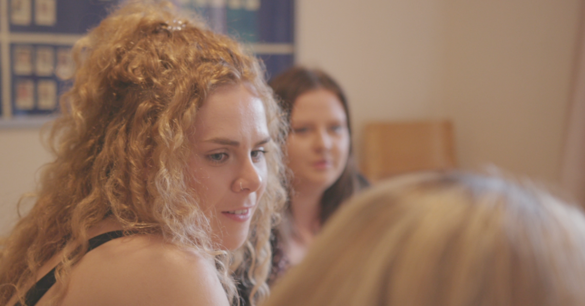 Support worker at house meeting at Elidyr Communities Trust