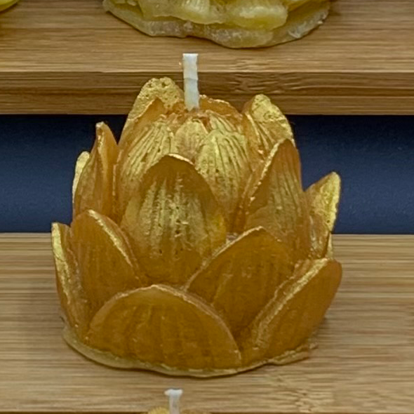 Gold lotus candle from Elidyr Communities Trust