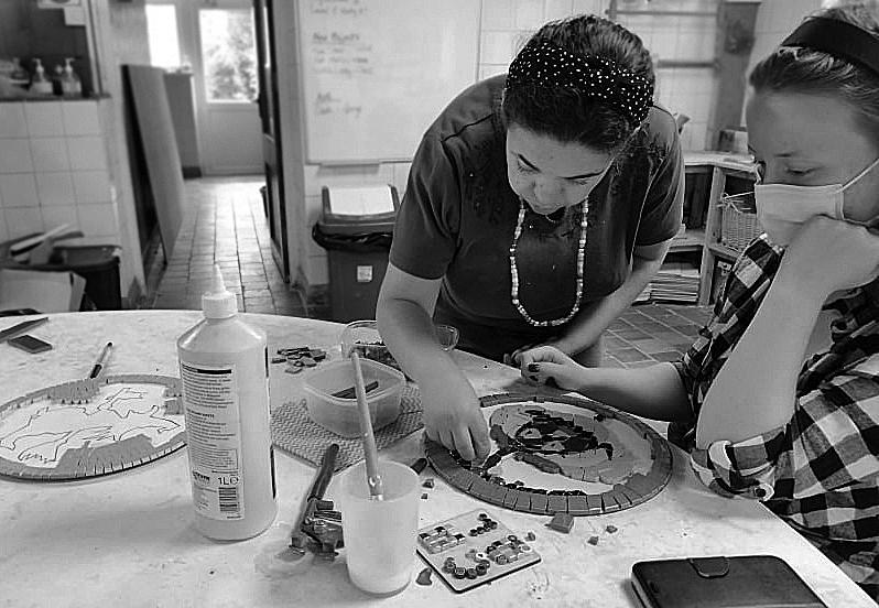 Girls making a mosaic 