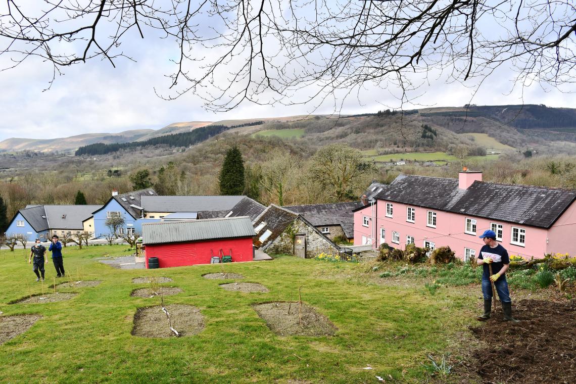 Blue, red and pink buildings at Elidyr Communities Trust