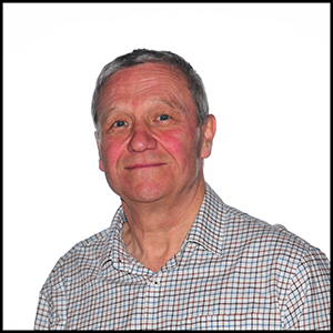 A headshot of a man in a checked shirt