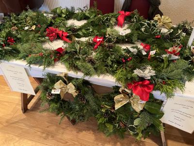Wreaths for sale on a table.