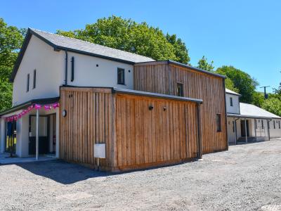 Education hub at Elidyr Communities Trust. A white building with cladding