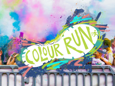 A colour run with puffs of paint in the area. A graphic footprint over the top says 'colour run'