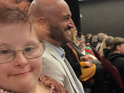Ellie and Geraint in the audience at an awards ceremony.