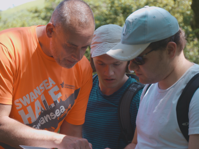 People reading a map.